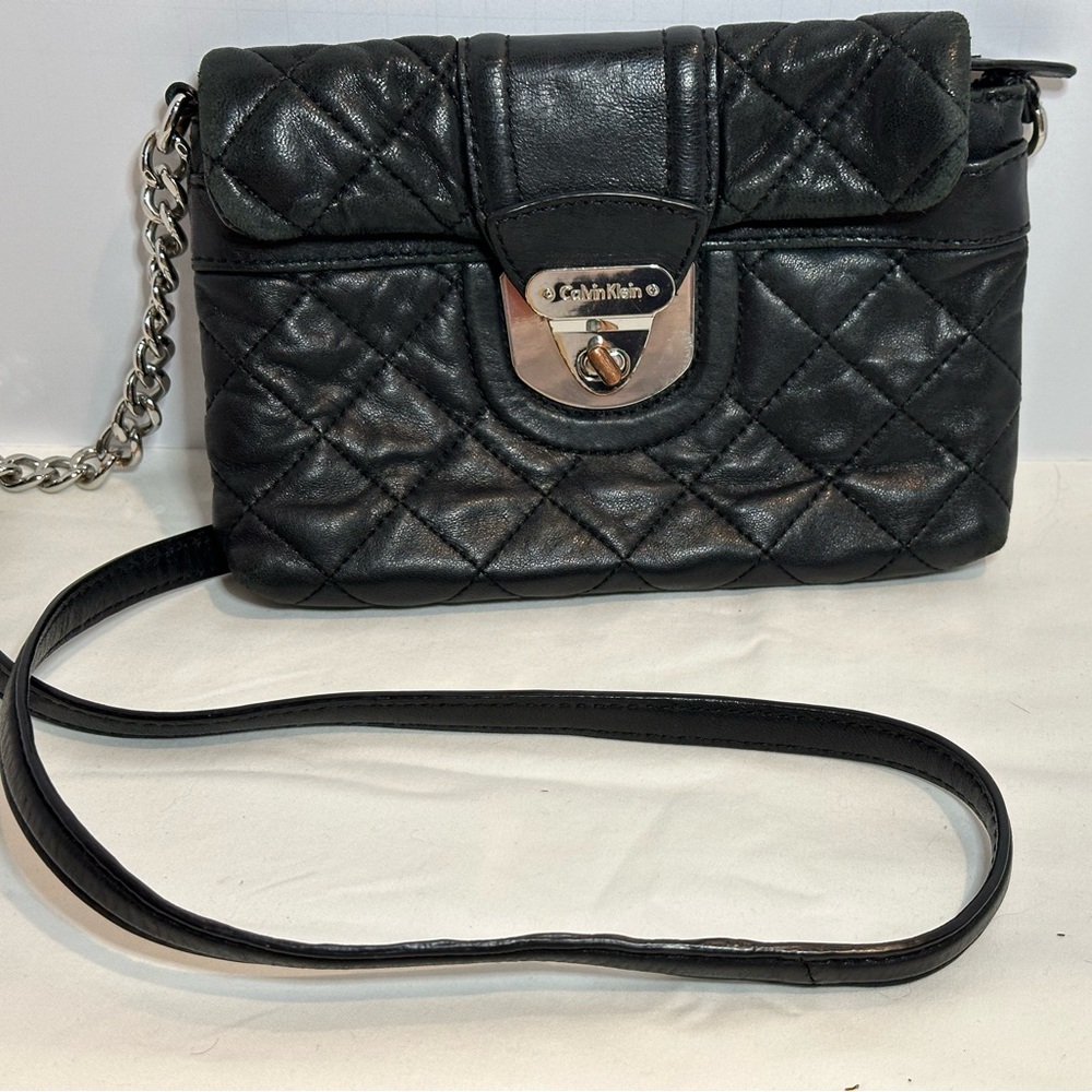 Calvin Klein black quilted cross-body purse with silver chain & leather strap.